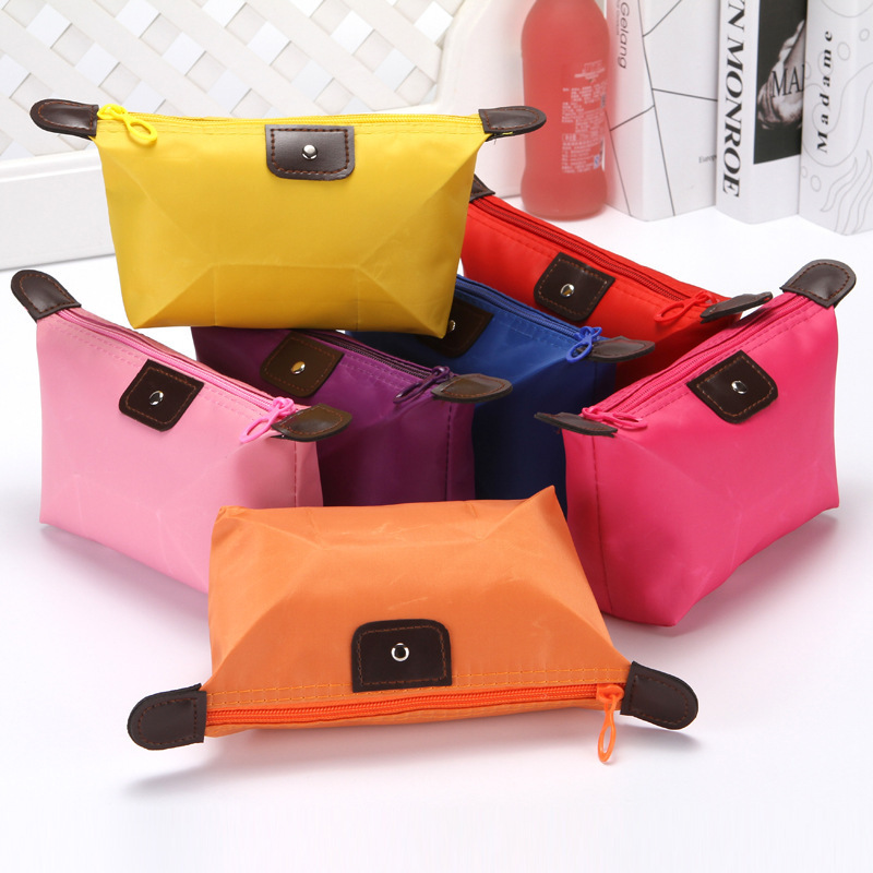 Korean version of cute dumpling cosmetic bag candy color folding dumpling bag ingot-type waterproof storage cleaning wash bag