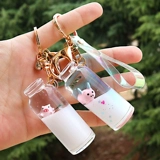 Плавающая свиная линия торговля ключом Ключевой цепь Перегающая песчаная бутылка с масляной свинью, молочной свинью, свининой, кремовой бутылкой дуйин