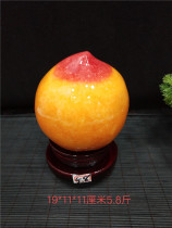 High-quality yellow dragon jade peach ornaments polished yellow wax stone original stone creative home office strange stone carvings ornamental stones