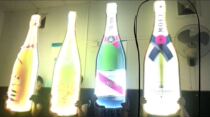 Champagne hand to raise the brand glowing name XO wine bar transmission props on the wine props bar creative advertising