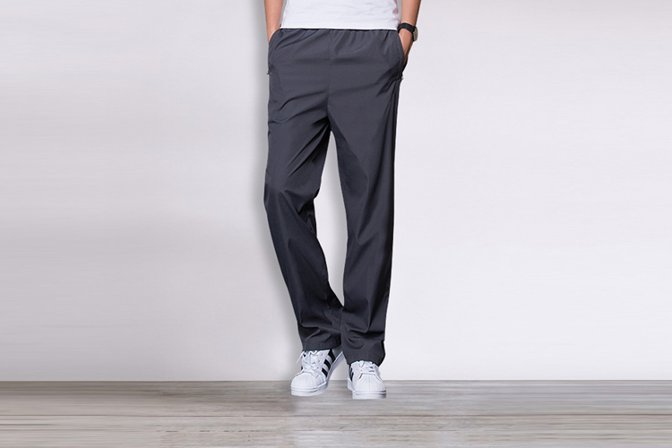 Quần thể thao nam mùa thu đông cộng với quần nhung dày polyester trượt mặt mặc ấm ấm quần baggy nam