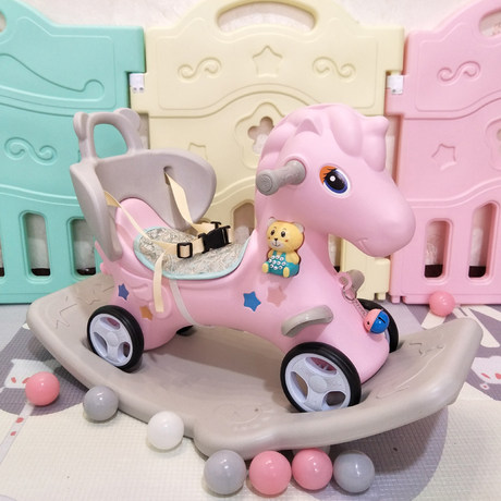 old plastic rocking horse