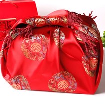 Newcomer with wedding supplies happy red brides accompanied by wedding festive baggage leather bag wrapping cloth