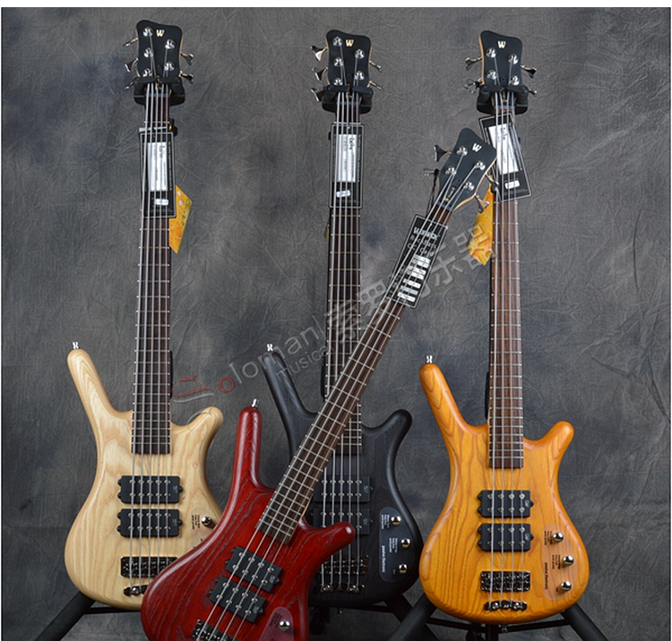 Warwick holds the Vibeth Bass Corvette $$ cruiser with a pair of US dollars