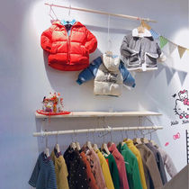  Clothing store childrens clothing shelf display rack Solid wood log color hanging rod Womens clothing upper wall positive side hanging rack wall hanging rack