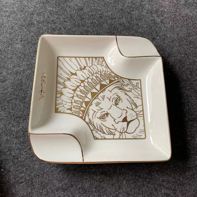 Rubinsky trademark LOGO lion head like a cigar duo in a cigarette ashtray