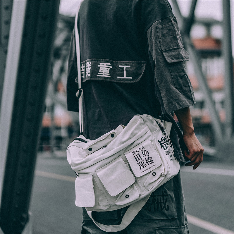 Giye Heavy Industry Package Pack for men and women Inclined Satchel Fields Island Transport Canvas Multi-Pocket Single Shoulder Bag Student Hand Satchel Wave