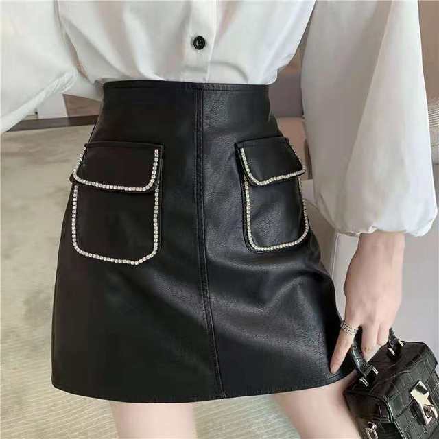 Solid color decorative diamond pocket PU leather anti-exposure A-line skirt for women in autumn and winter new style fat MM popular high waist hip skirt