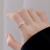 Adjustable index finger ring with bud ring opening