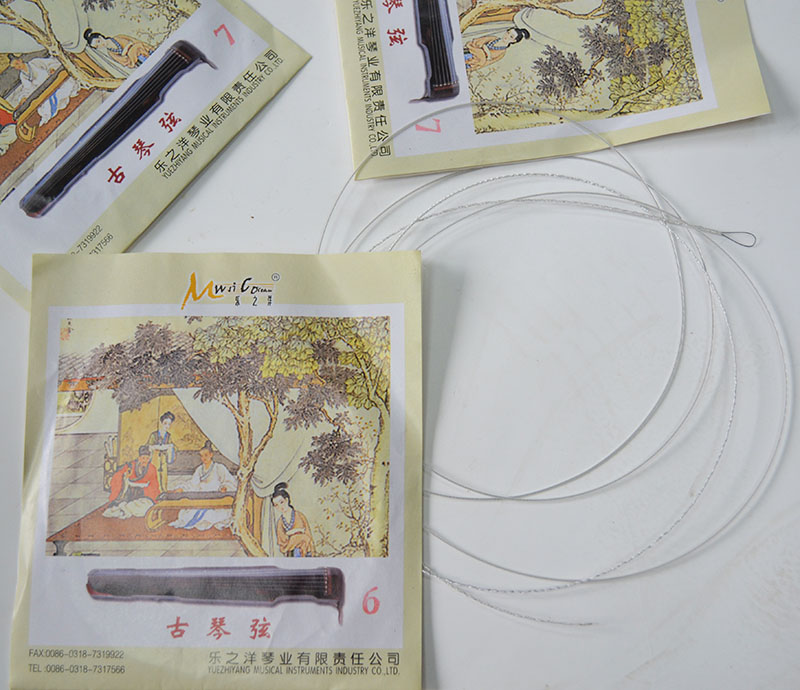 Le Yang Gu Guxian dây cổ chuyên nghiệp dây Guqin phụ kiện nhạc cụ dây bán nhà máy trực tiếp Kẹp đàn guitar giá bao nhiều