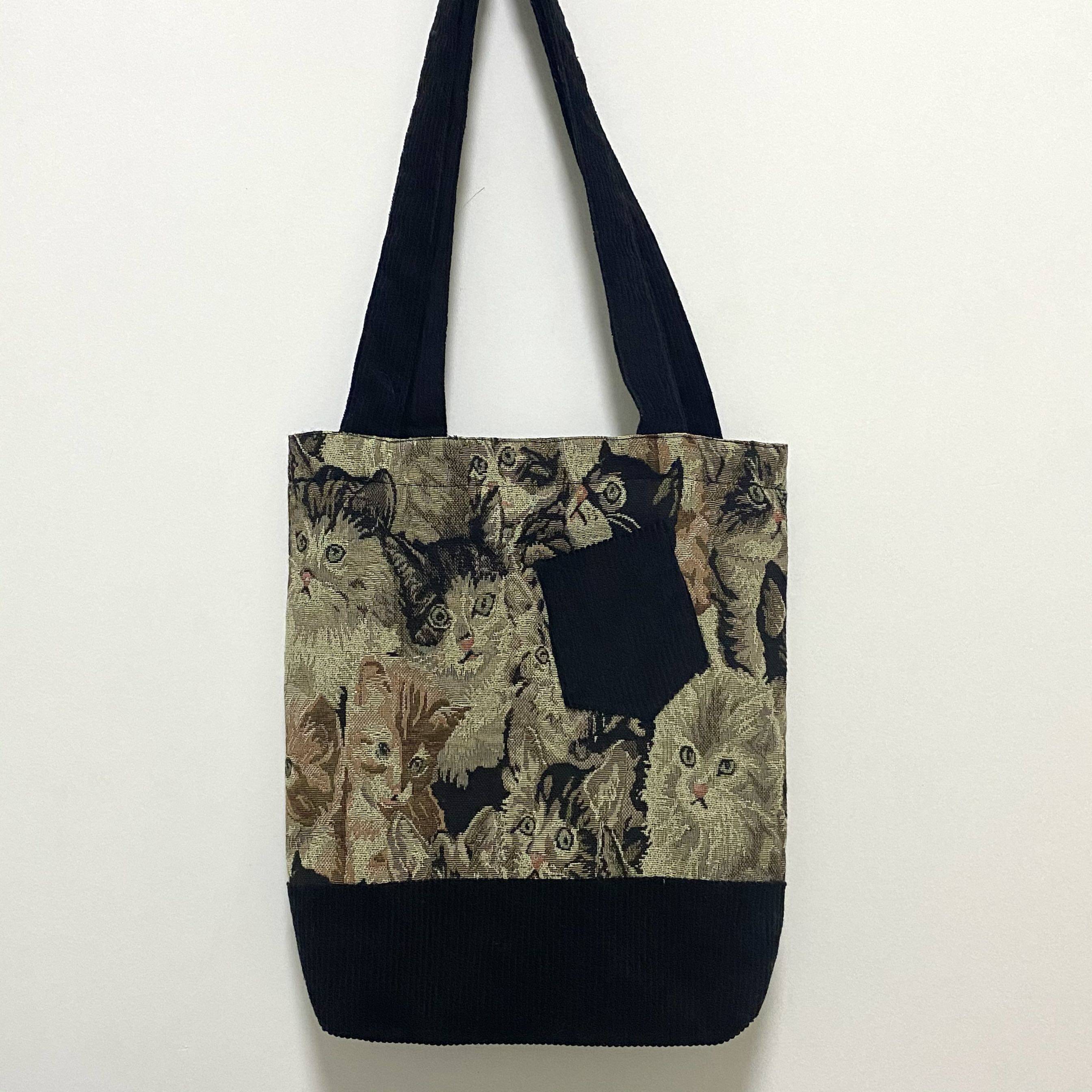 High-level sense (walking the streets and alleys) high-quality fabrics are full of cat clutches