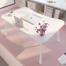 The small table on the notebook bed the small table the dormitory the college student Lazy desk the bedroom is low.