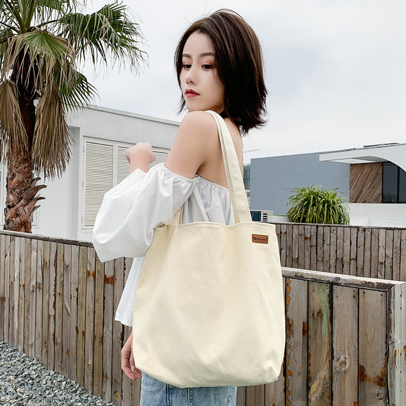 Canvas bag girls 2023 new single shoulder large capacity simple Japanese handbag college students attend class cloth bag