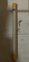 Outdoor fishing rods in a bucket with two rods one long and one short