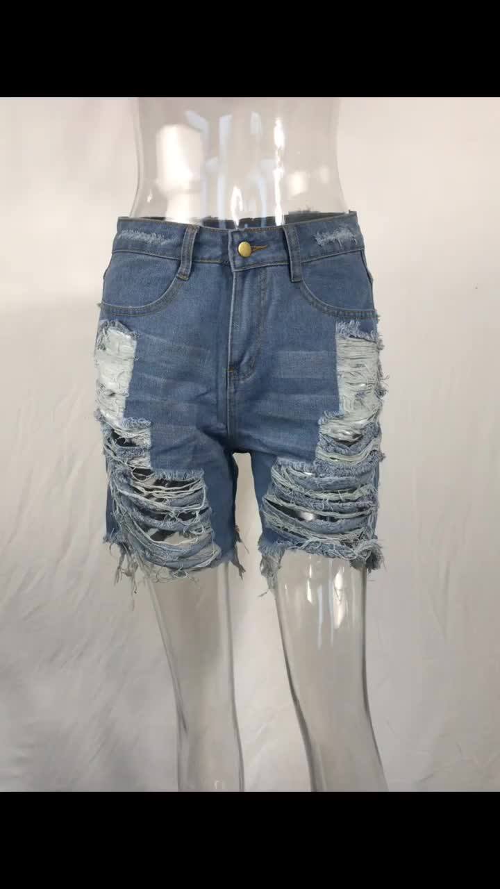 Denim shorts with pockets hanging online out