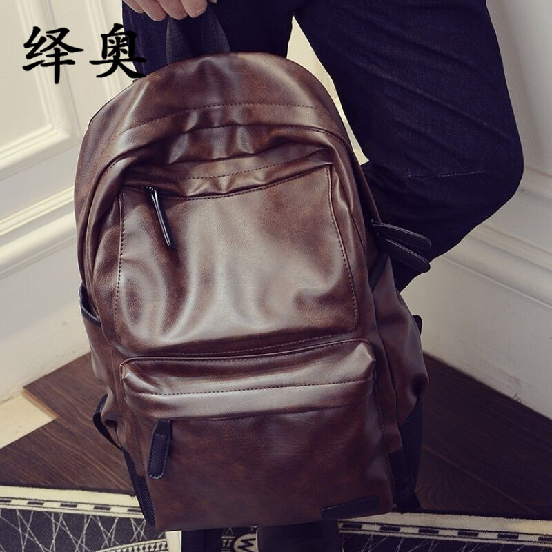 Trendy men's casual fashion backpack business solid color waterproof computer backpack large-capacity college style soft leather schoolbag