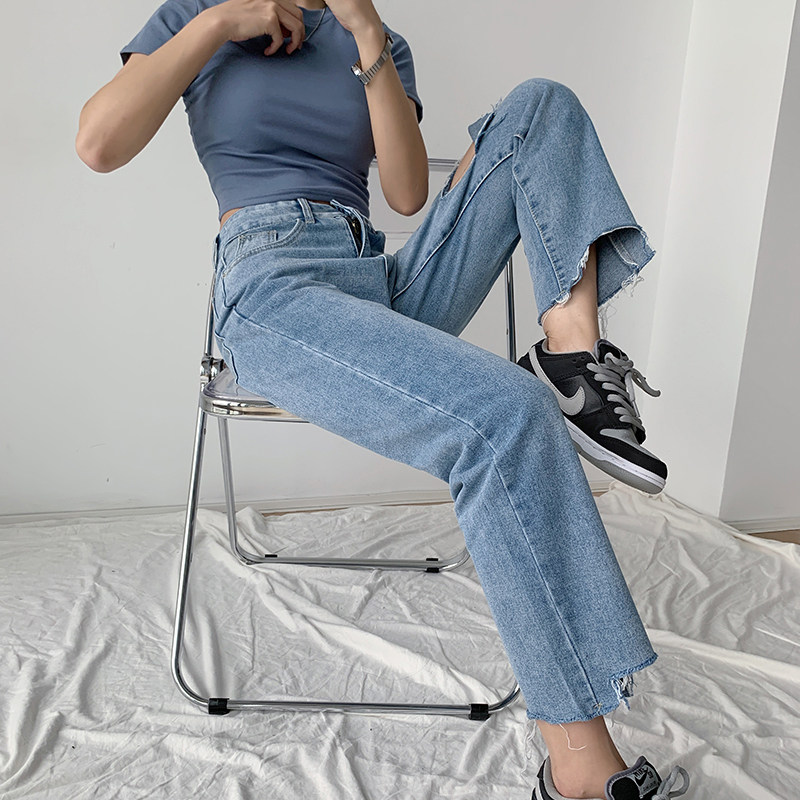 The new tide of dress 2023 is a new tide for crack - hole cross jeans female straight tube loose high waist pants