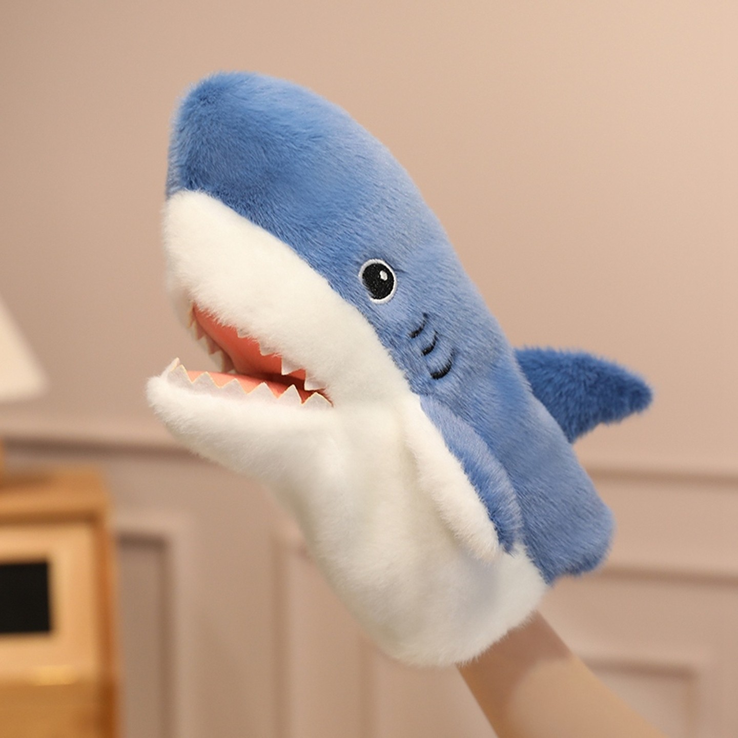 Shark hand puppet toy with open mouth, animal finger gloves, plush interactive doll for children.
