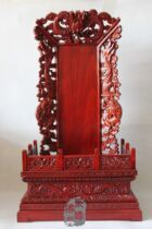 Incense and wood sculpted dragon-like ancestorsancestors ancestors to the birth lotus place home to the first mans throne