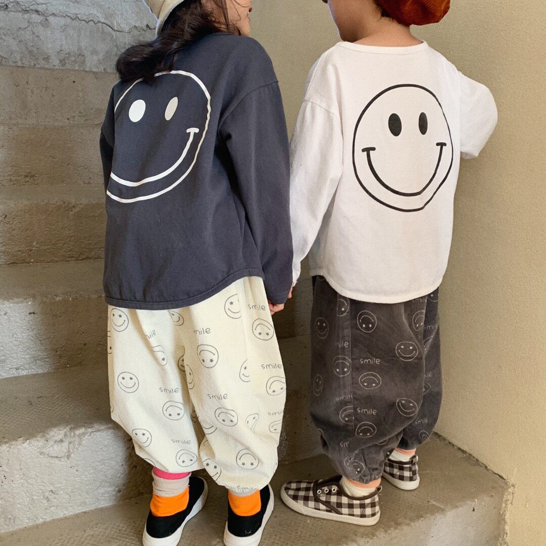 Children's corduroy trousers trendy spring new Korean version boys and girls baby smiley loose radish trousers leggings trousers