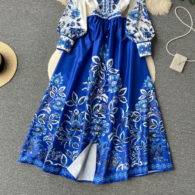 2023 spring new holiday style V-neck puff sleeve printed dress women's French retro big swing over the knee long skirt