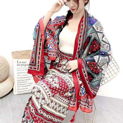 For a vacation in Xishuangbanna with ethnic style, a cloth-style exotic retro printed summer sun protection outer scarf is worn by a woman