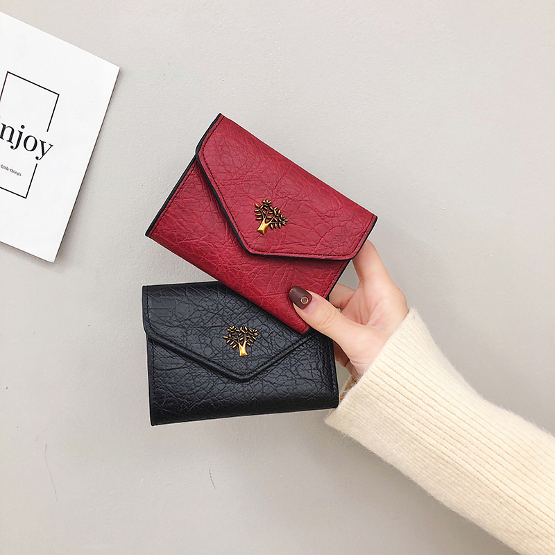ins small wallet women's short 2021 new Korean version of the tide simple multi-functional three folding buckle thin change clip