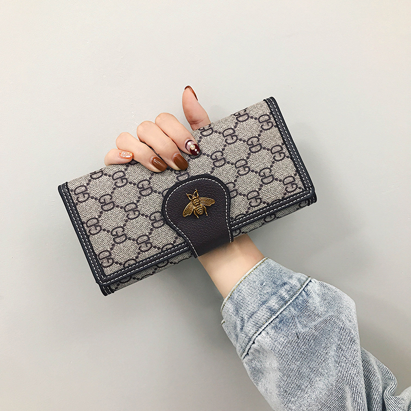 2021 new women's wallet female long version of the Korean version of the tide three folding large capacity multi-card buckle women's clutch bag