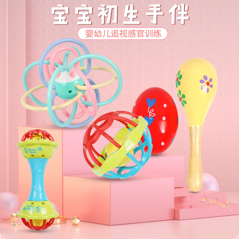 Newborn baby picks hole toy ringing handle bells can bite birthbaby sand sand soft glue ball