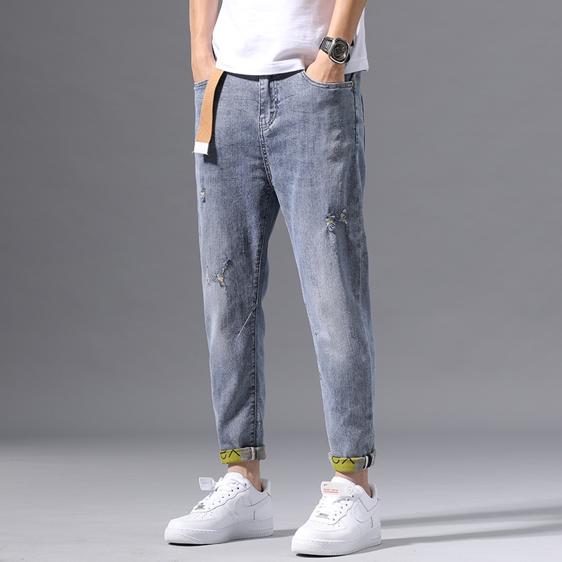 Hong Kong high-end jeans men's Tide brand spring/summer 2020 hole elastic slim feet light color long pants