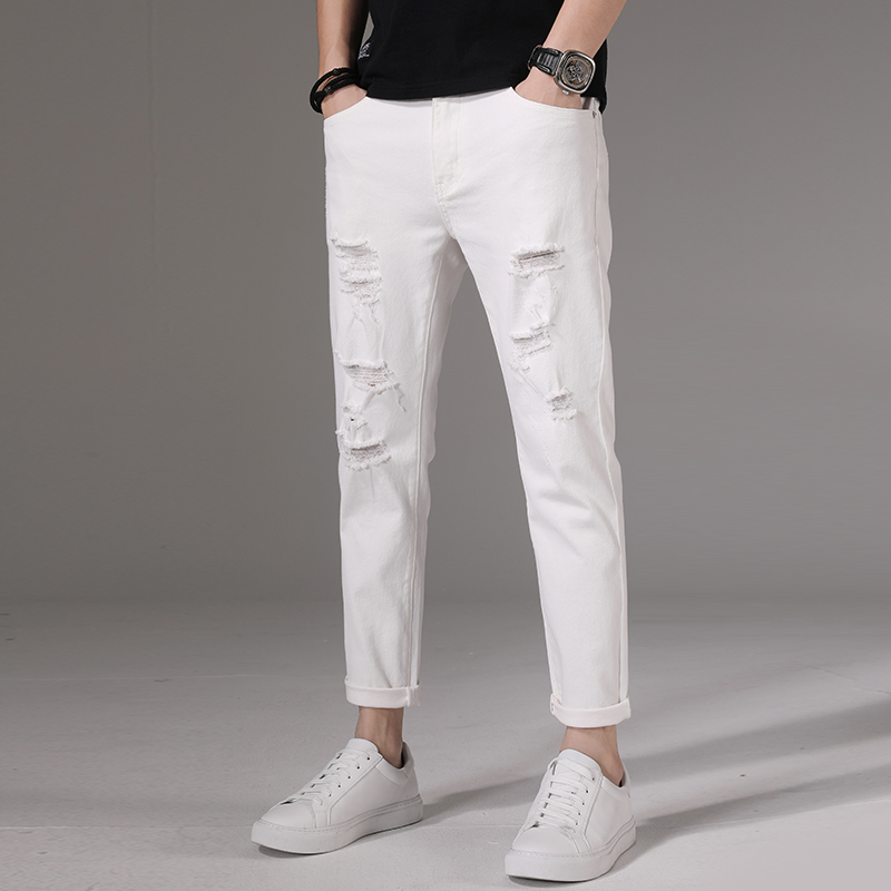 Hong Kong high-end summer thin white jeans men's ripped tide brand slim small feet nine-point pants men's summer