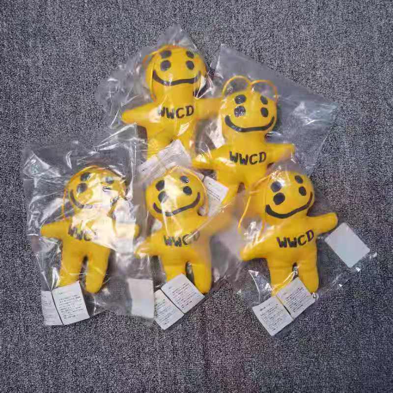 CPFM jointly named Huang bag hang piece four smiling face doll pack hanging cartoon doll
