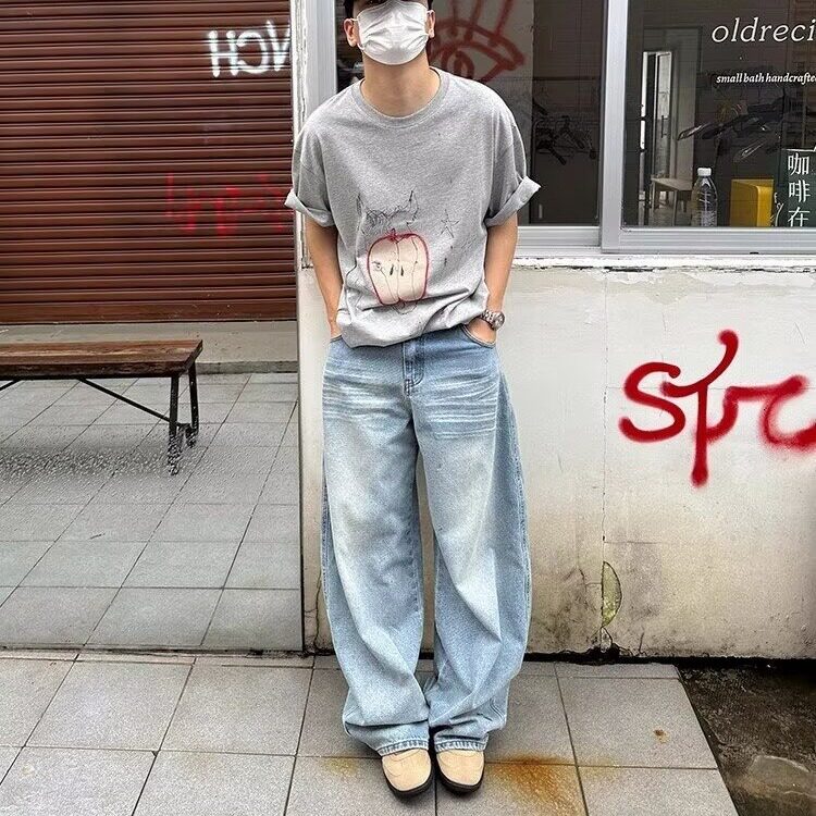 春夏季潮流韩版痞帅宽松哈伦裤水洗破洞乞丐裤青年男士牛仔裤图片