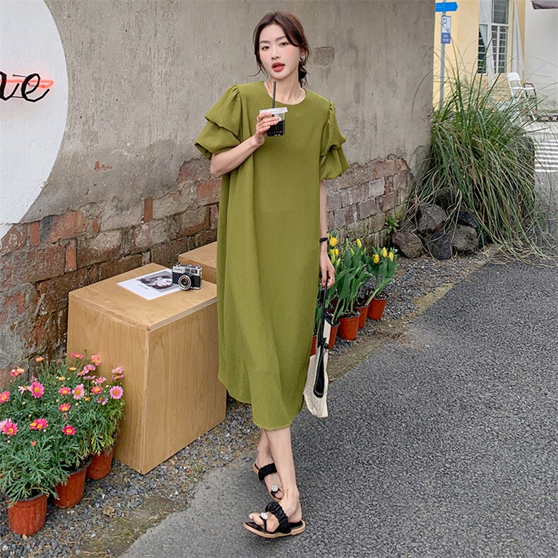 绿色泡泡袖连衣裙女2025夏季新款韩版设计感遮肚子显瘦后开叉长裙图片