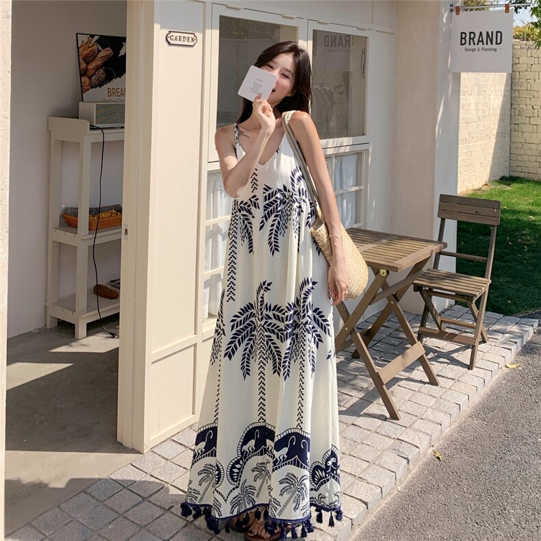 海边度假松弛感吊带连衣裙女2025年夏季新款印花流苏气质休闲长裙,女装连衣裙,诺蝶