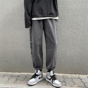 潮牌束脚裤春秋季新款排扣牛仔裤男士韩版潮流宽松长裤子k30-p40,男装牛仔裤,星座1008-1