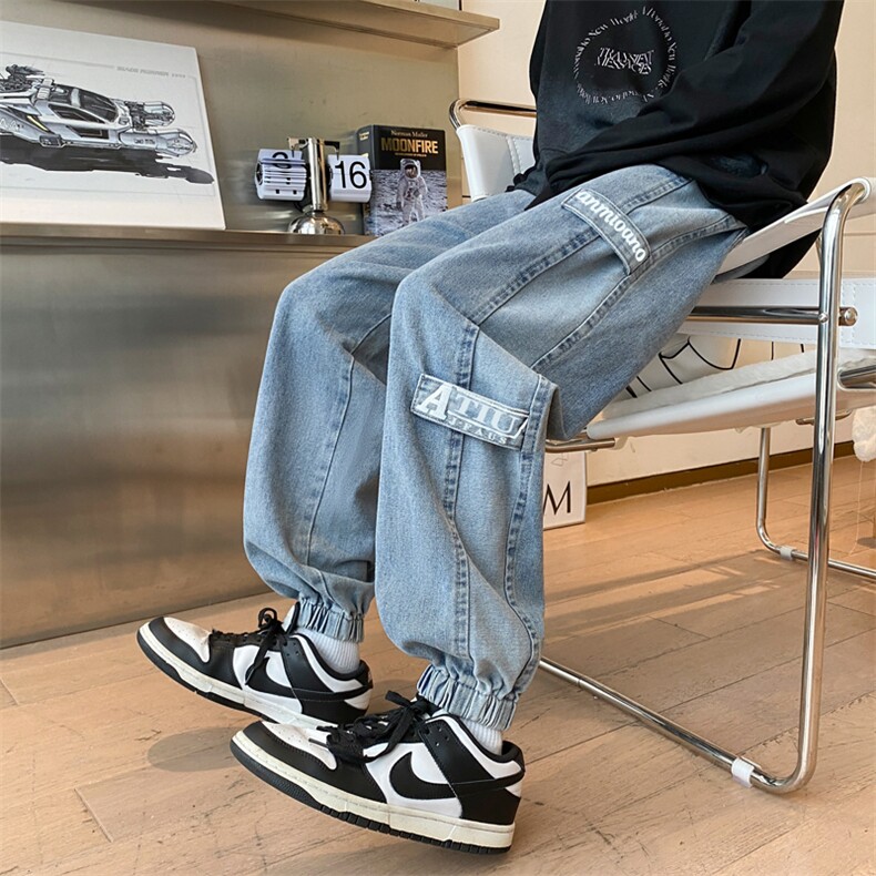 港风秋款男牛仔裤字母印花织带条纹拼接束脚裤NK627 P45图片