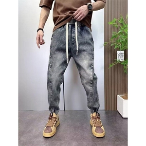 复古水洗牛仔裤男2025新款潮牌宽松束脚哈伦裤痞帅排扣休闲图片