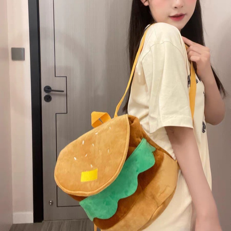 懒羊羊汉堡双肩包可爱背包儿童卡通包包女搞怪大容量小书包礼物中，AI毛绒玩具包