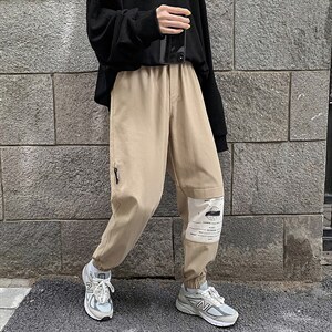【】A003-HZ7221-P50新款拼接印花休闲裤 女模图片