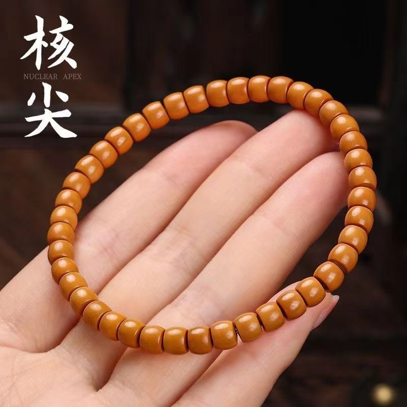 野生橄榄核核尖手串：文玩界的时尚新宠，你值得拥有！-菩提-淘宝好物网
