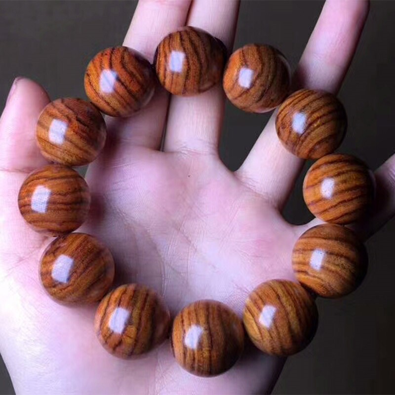 Hainan huanghuali tiger skin pattern bran pear old material along the grain high density high oily hand string hand chisel collection gift for personal use