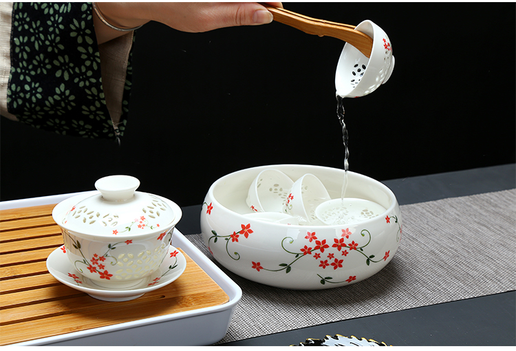 Fujian macros and exquisite tea sets of cellular kung fu tea cups of a complete set of ceramic household hollow out lid bowl and exquisite tea set