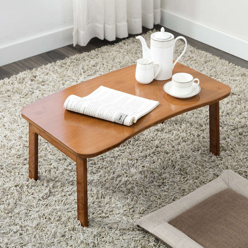 Folding table bed with a sitting table on the floor of the dining room with a small table tatami bed and a floating window-window-style laptop computer desk