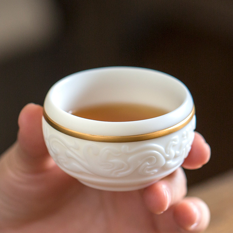 Don difference up relief xiangyun cup of dehua white porcelain manually kung fu master sample tea cup ceramic cups cup single cup of tea