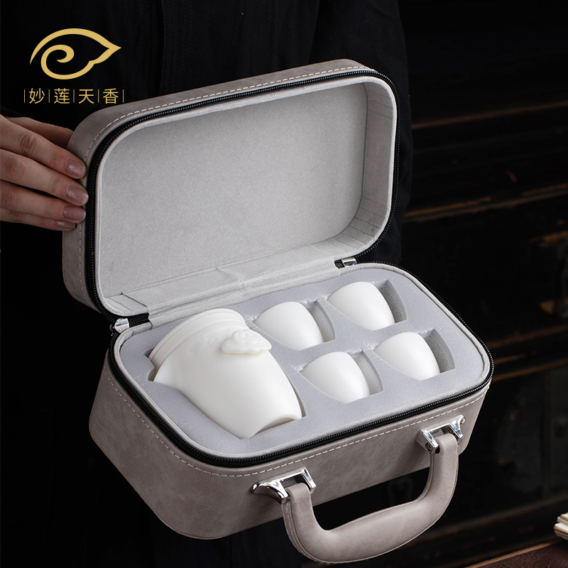 Travel portable bag Gongfu tea with quick passenger cup Dehua goat fat jade Porcelain One Pot of Four Travel Tea Set Express Guest Cup