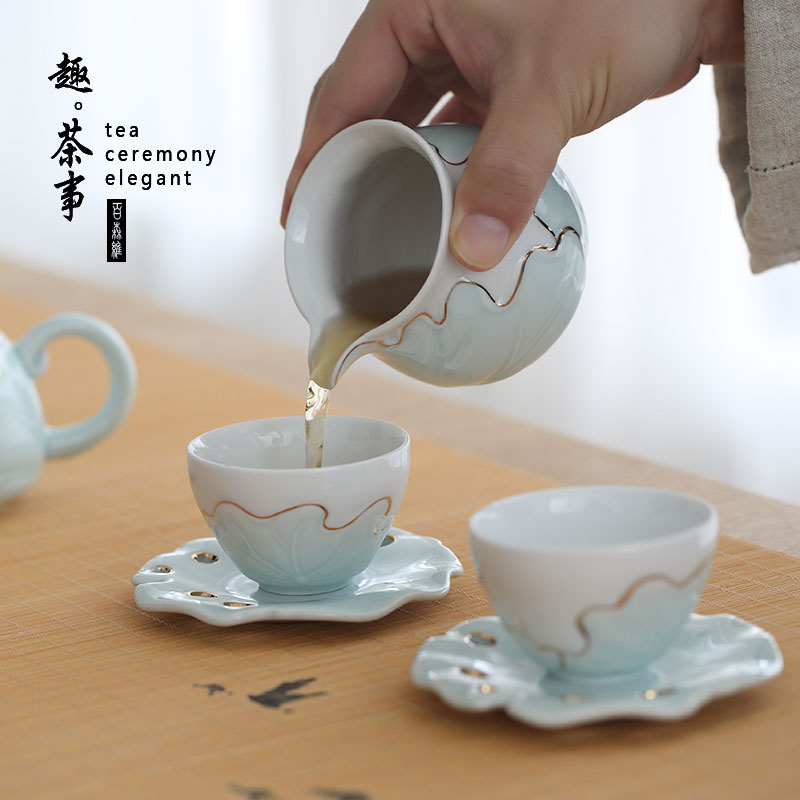 An Inset jades celadon tea set ceramic tea wash to contracted household kung fu tea cups cup mat of a complete set of gift boxes