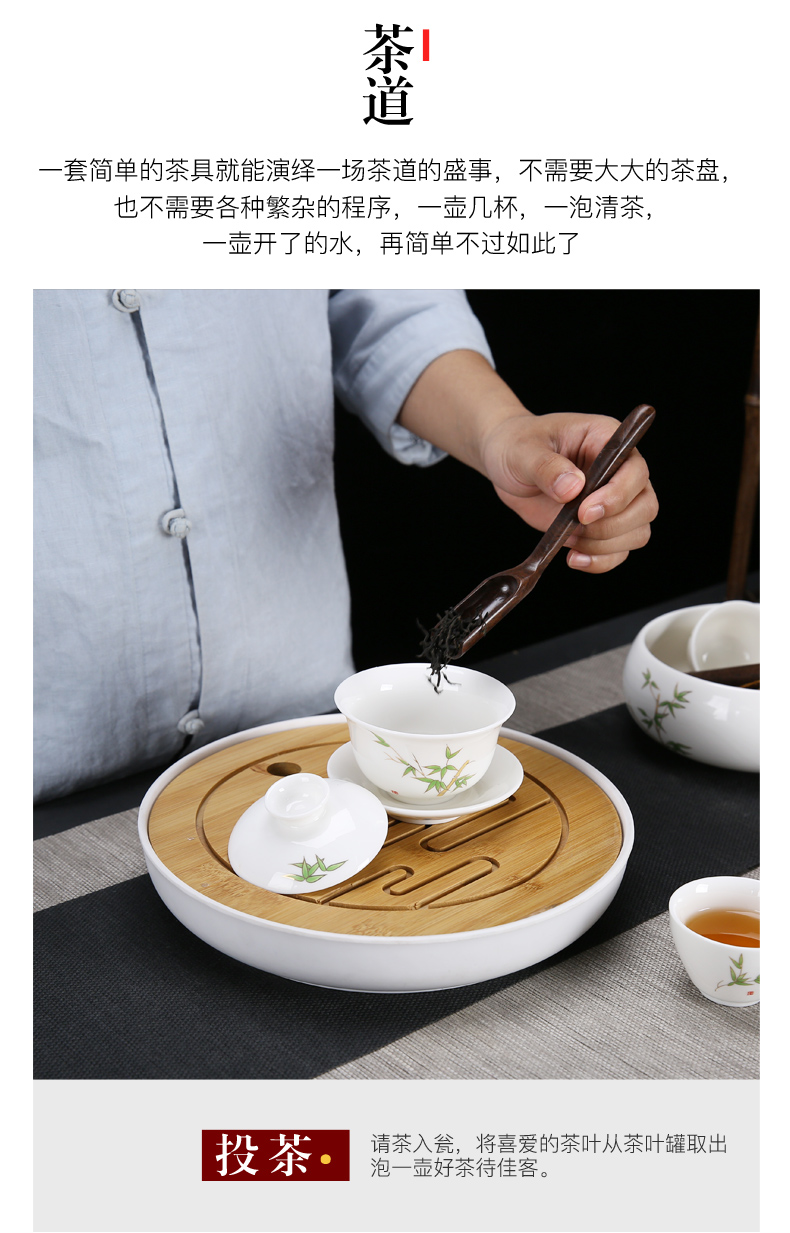 Dehua white porcelain kung fu tea set suit household suet jade cups of a complete set of the tea pot lid to use simple wooden side