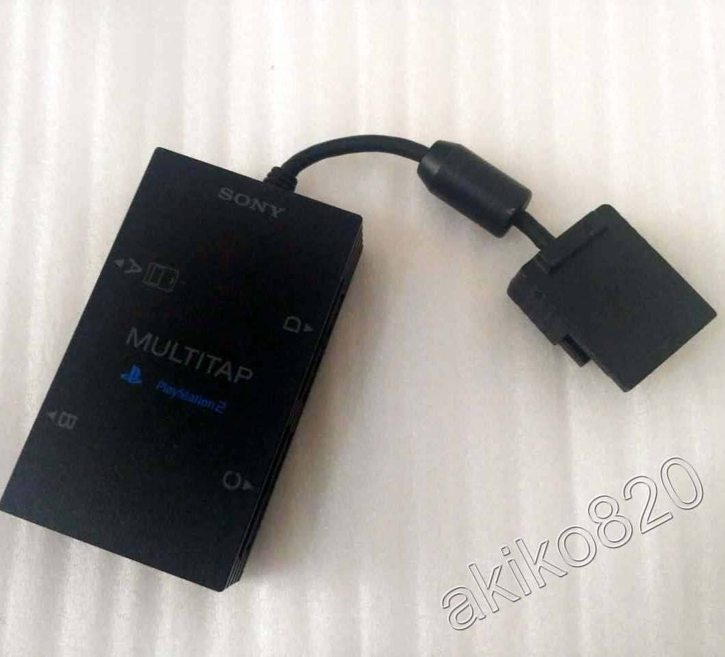 Оригинальная ручка игровой консоли PS2 вставлена в SCPH-70120 SCPH-10090, которая может быть подсоединена к 4 раздвоенным ручкам