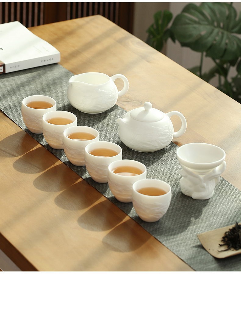 Dehua suet jade biscuit firing manual white porcelain kung fu tea set suit household ceramic teapot of a complete set of tea cups